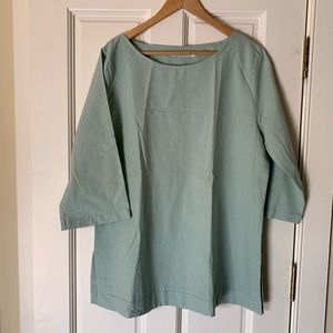 Never worn. Pale green-blue flowing top.